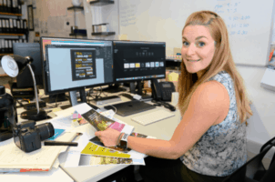 A marketing professional at their desk.