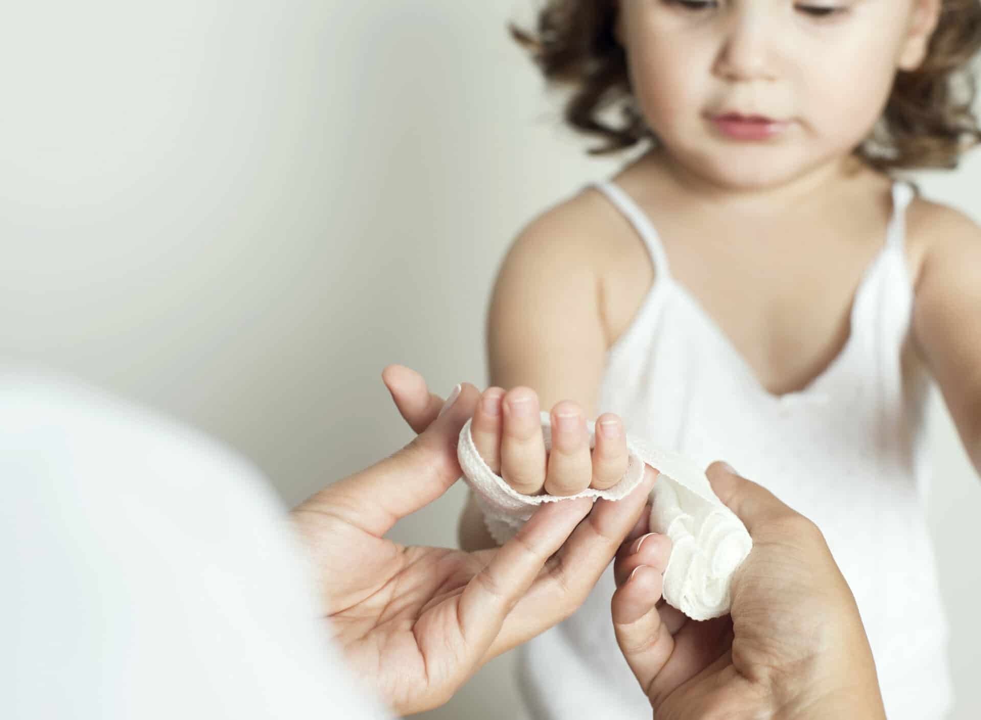 Pediatrician is taking care of a child, horizontal
