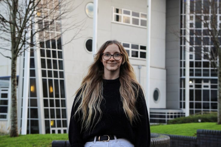 Amy stood in front of a Penwith College building