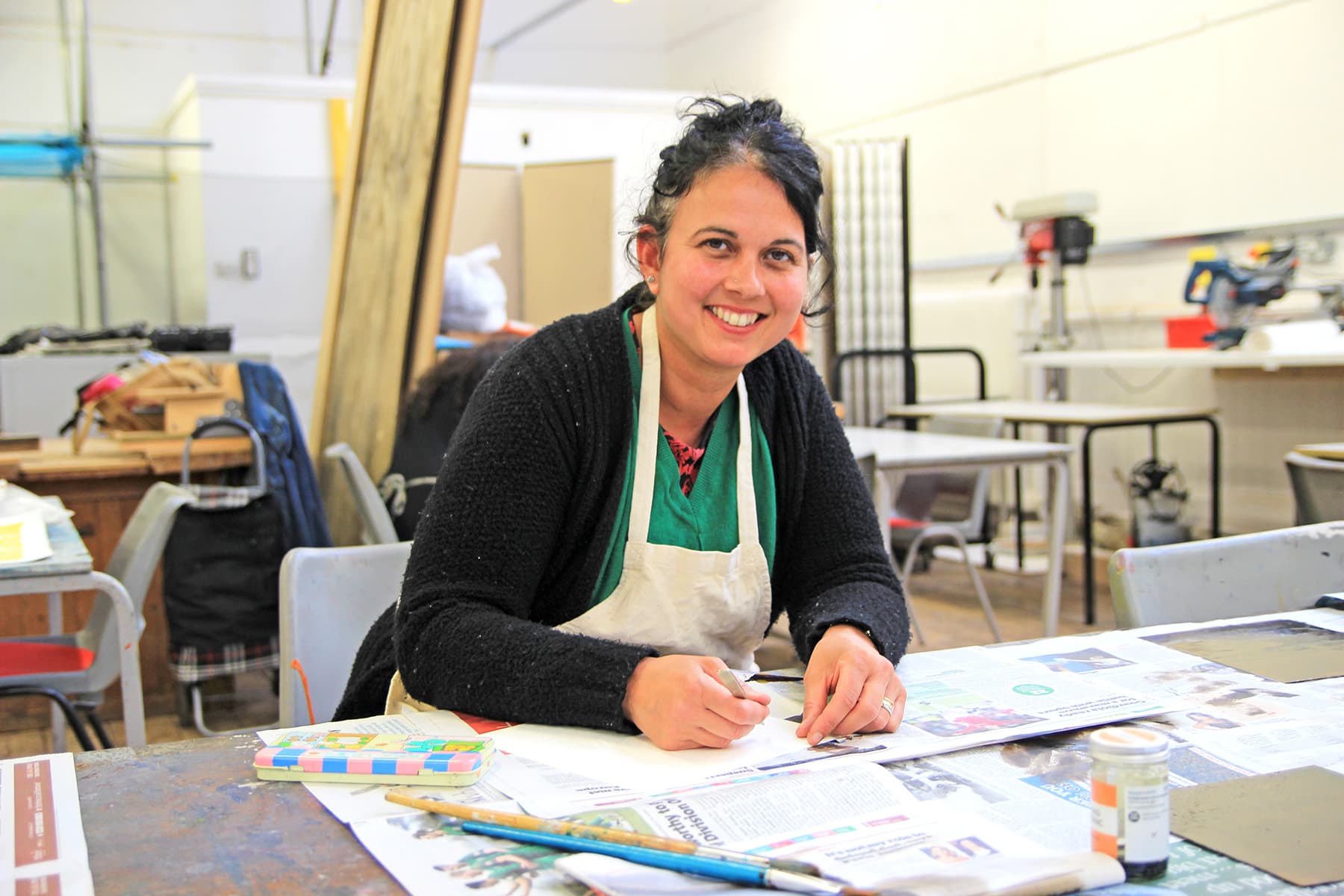 Part Time 00002 A part time leisure student looks at the camera and smiles. They look to be taking part in a creative class.