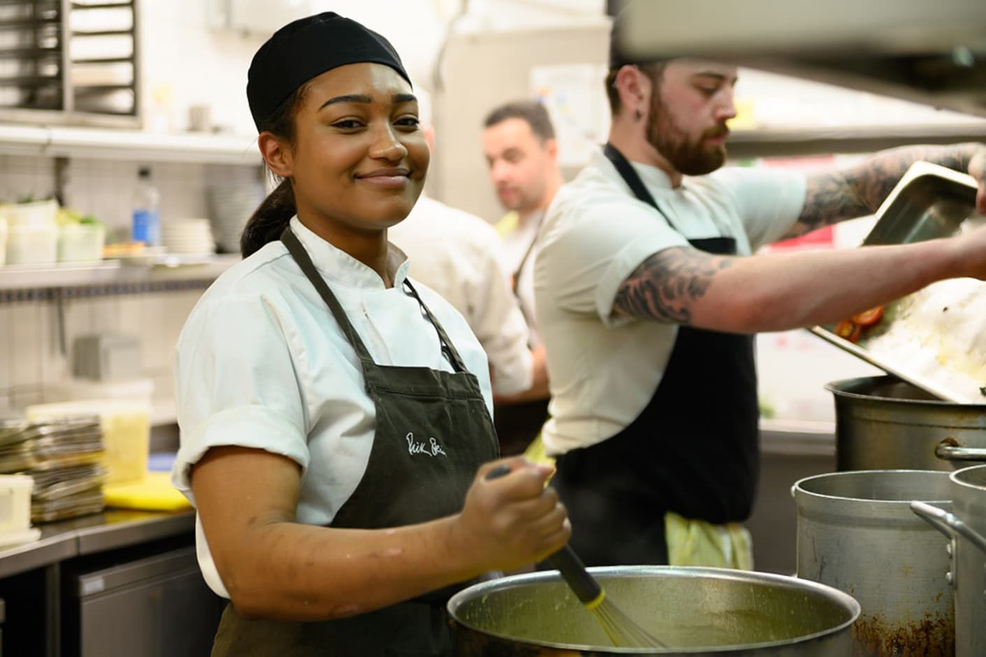 A Hospitality learner working in a professional kitchen