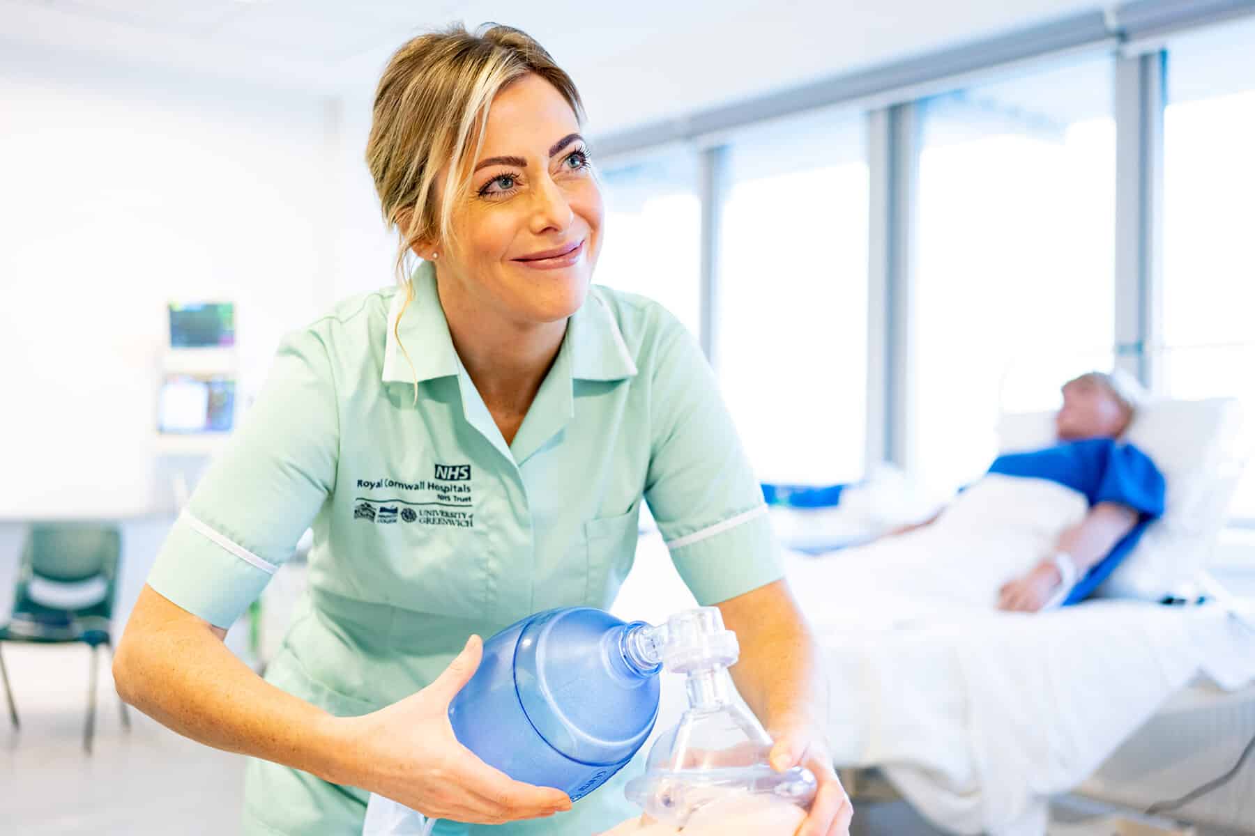 A nursing and allied health student uses the simulation suite at the college.