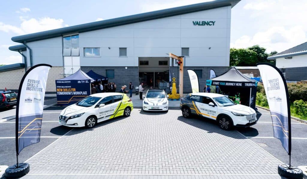 Three of the College's electric vehicles outside of the Valency building at Truro College