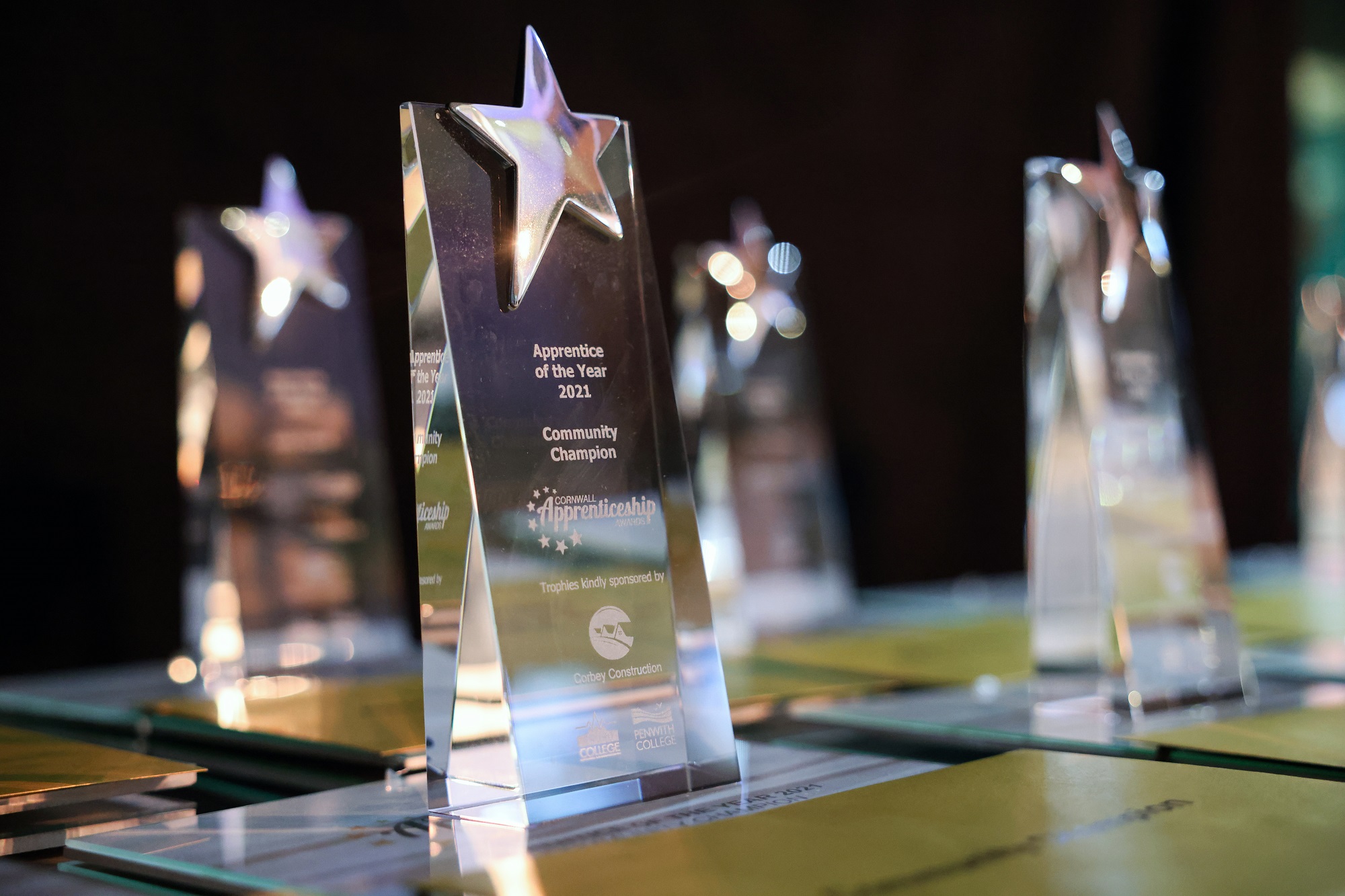 A shot of the glass trophies and gold envelopes at the Cornwall Apprenticeship Awards