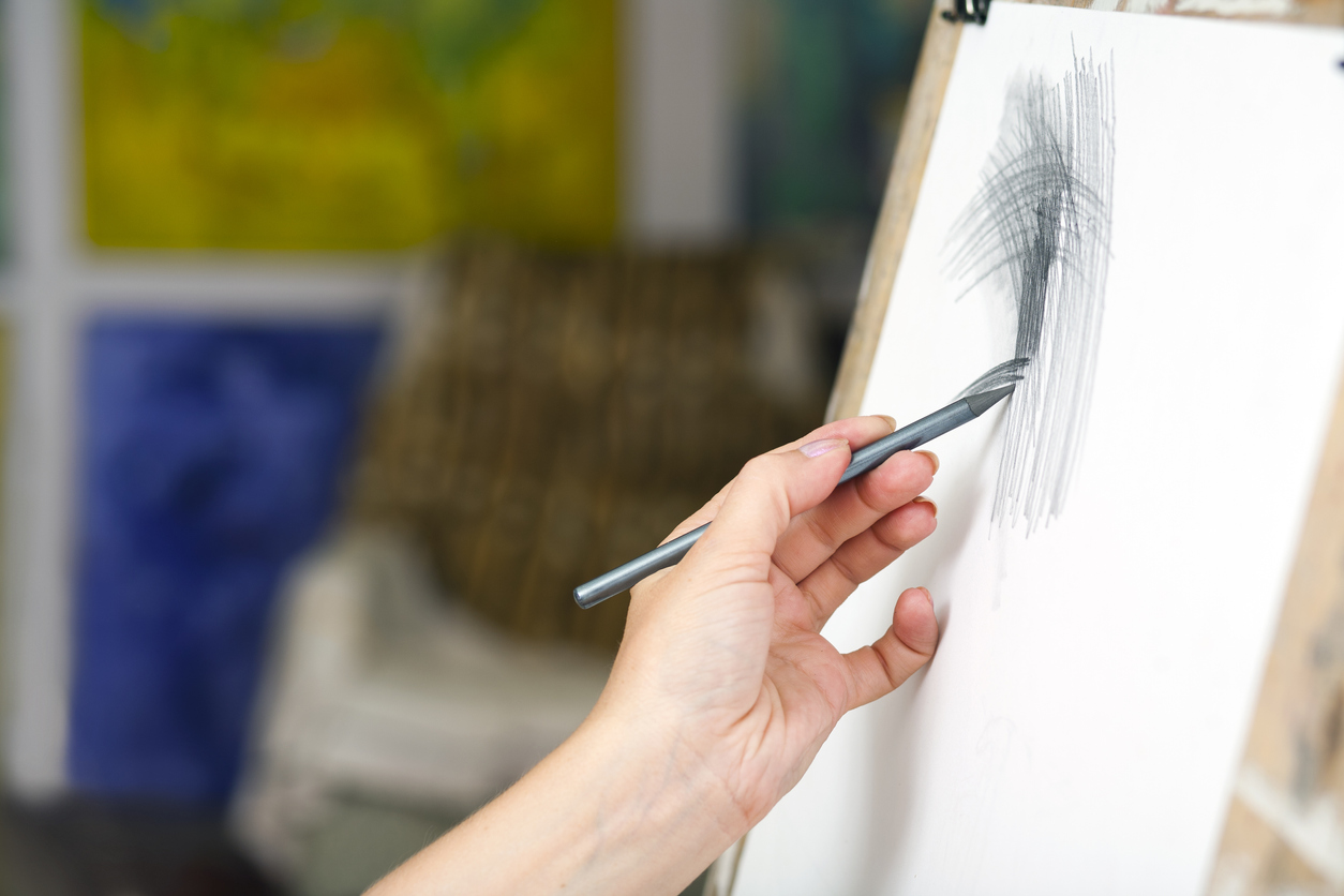woman paints in the studio