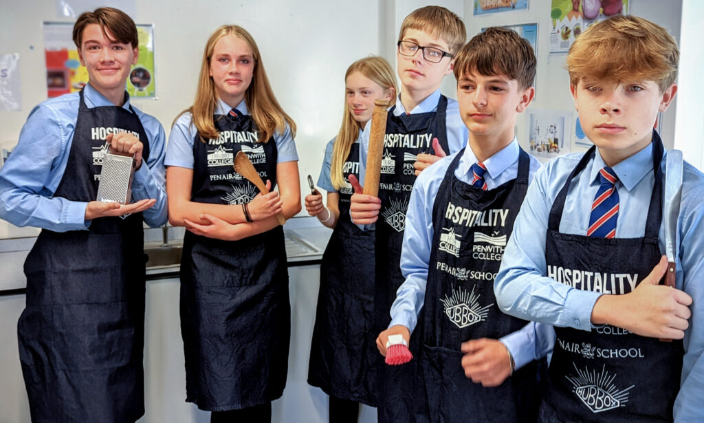 Penair School Students With Aprons