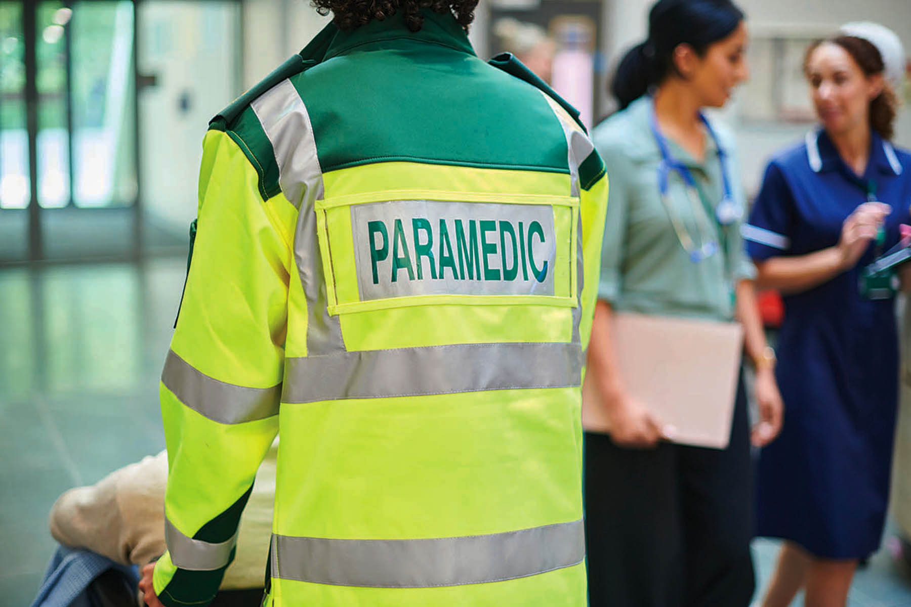 paramedic bringing patient to hospital