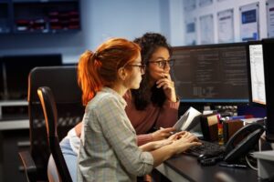 Adult women working at a computer