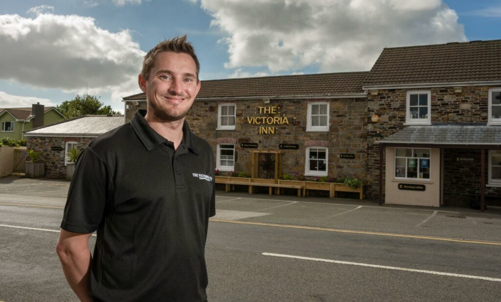 Mark Holden Inn Cornwall Ltd stands outside one of his pub-restaurants, the Victoria Inn, Threemilestone