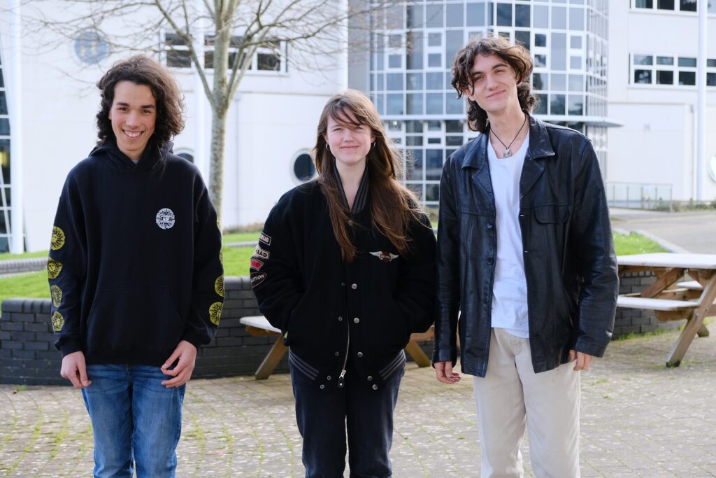 Three students on campus at Penwith College.
