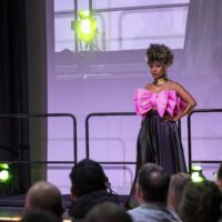 A model, prepared by Hair and Beauty students on a catwalk