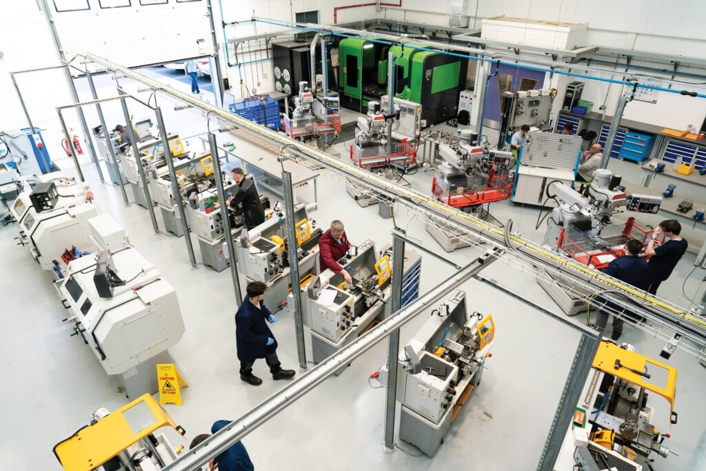 A view from above the engineering bay in the Valency building. You can see students and staff at work.
