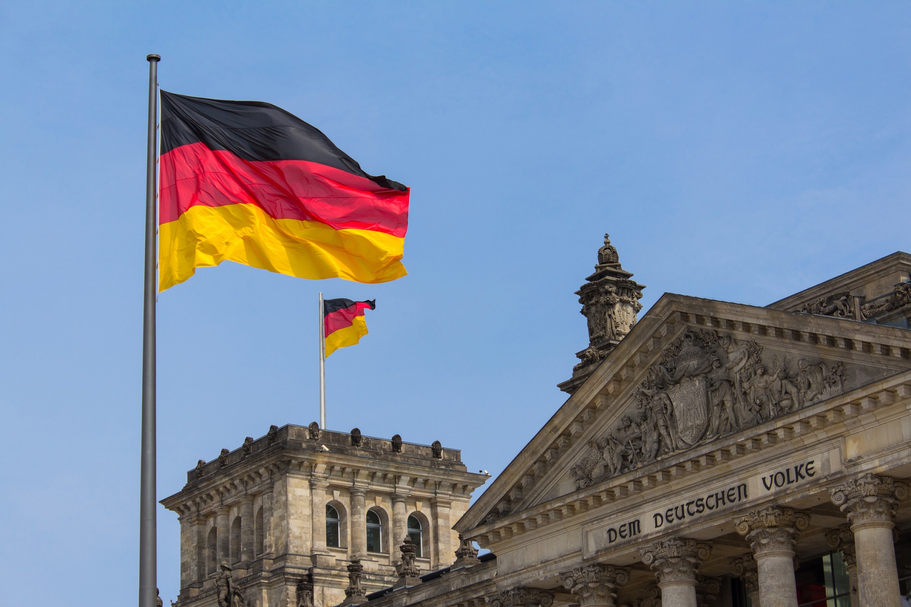 German flag on Reichstag building in Berlin: German parliament