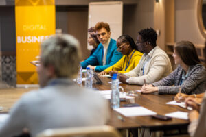 Business People Taking Notes During A Business Conference