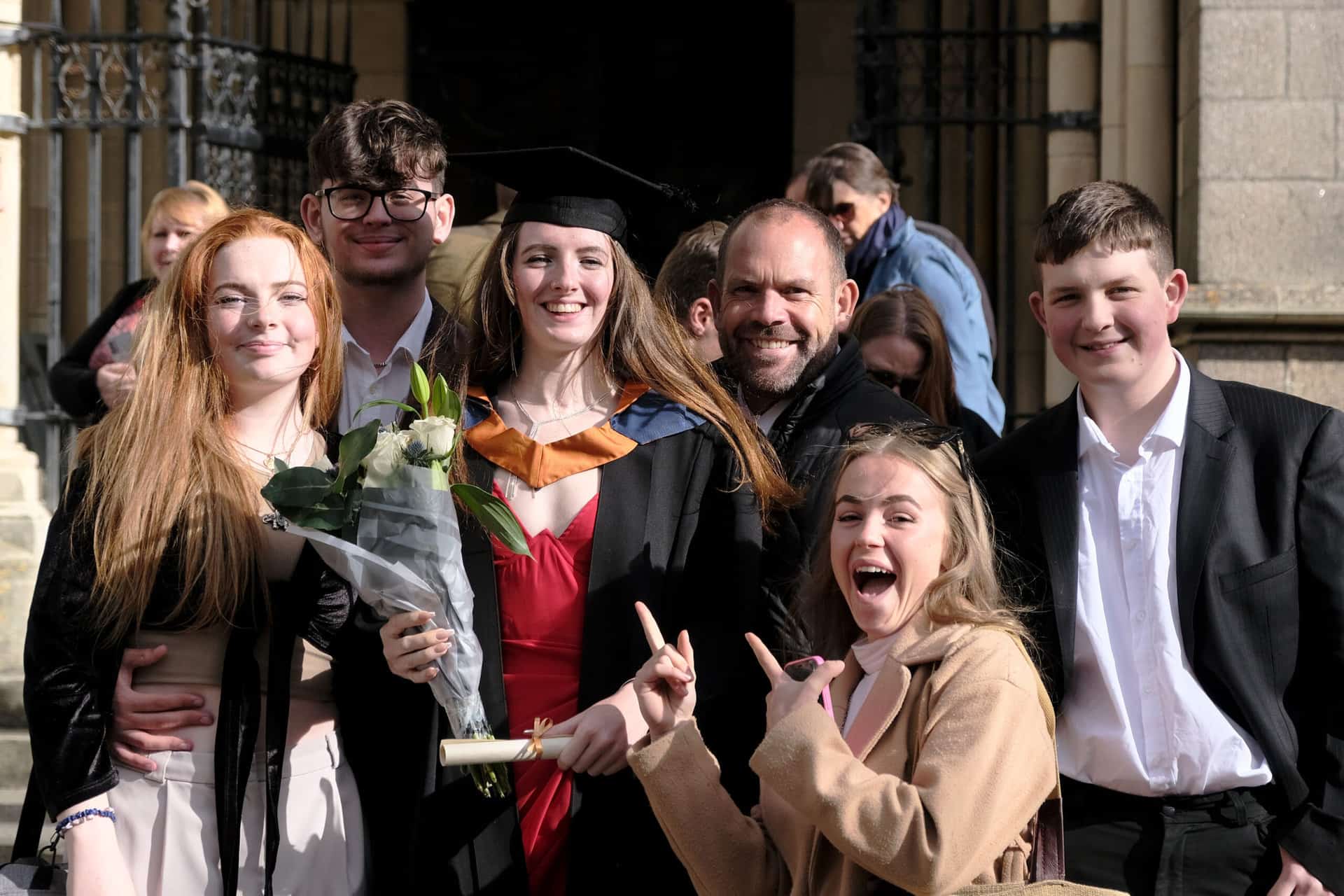 The University Centre Truro & Penwith Graduation 2023. A group image of a graduate with her family outside the cathedral.