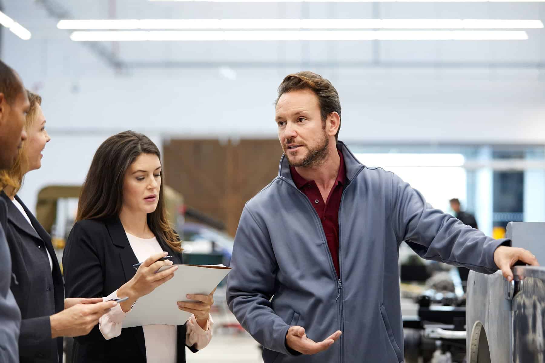 A team leader is having a discussion with colleagues