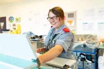 A student nurse works with equipment in the simulation suite at the University Centre Truro & Penwith