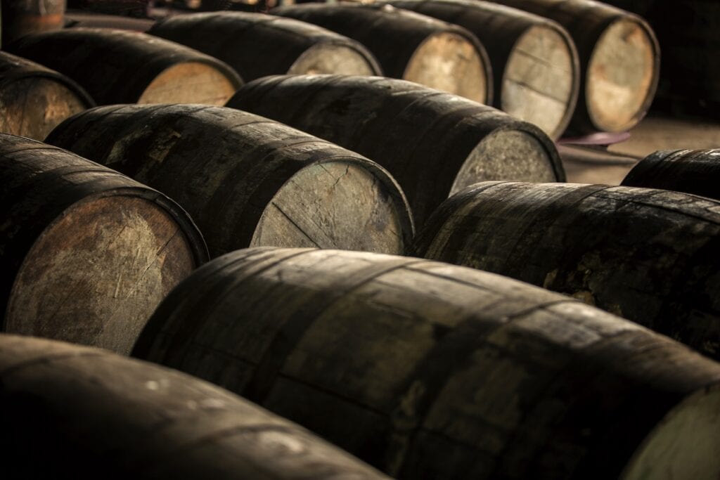 Old wooden (oak) barrels. Rum or wine aging process.