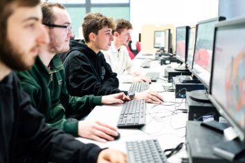 University students sit st computers on the Modern Methods of Construction course.