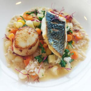 Pan-fried sea bass with Autumn vegetables and a Camel Valley bacchus wine sauce.