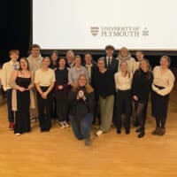 The winning law students are pictured with the trophy.