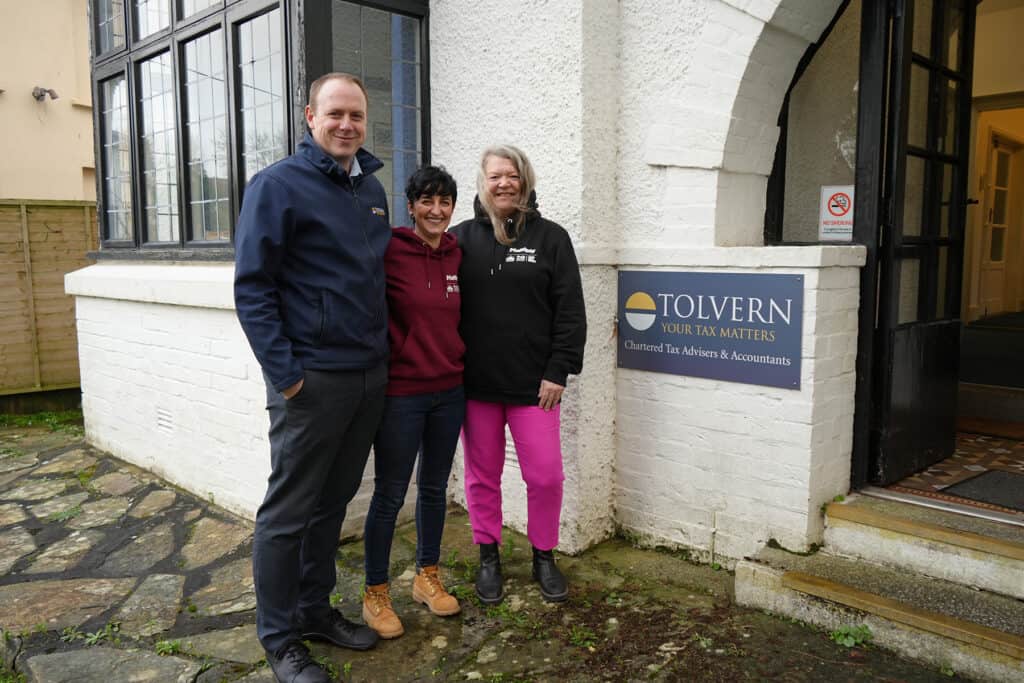 An image of three members of staff from truro and penwith college outside a tax advisers and accountants firm.