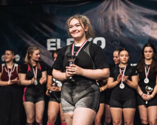 Ami, sport student, collecting an award.