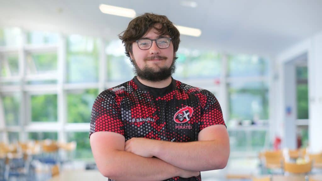 Young male student in a red rugby top
