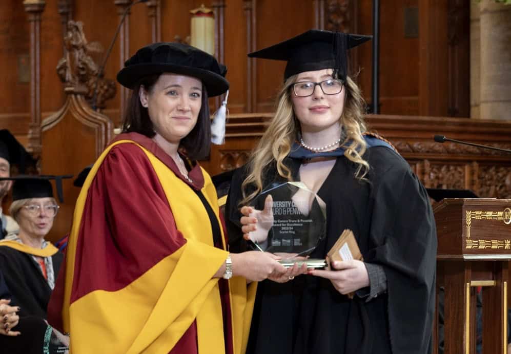 Scarlet Received Her Award From Dr Emily Myatt - Graduation 24 Graduate, Scarlet, in cap and gown receives her glass trophy from Dr Emily Myatt also in her academic dress.