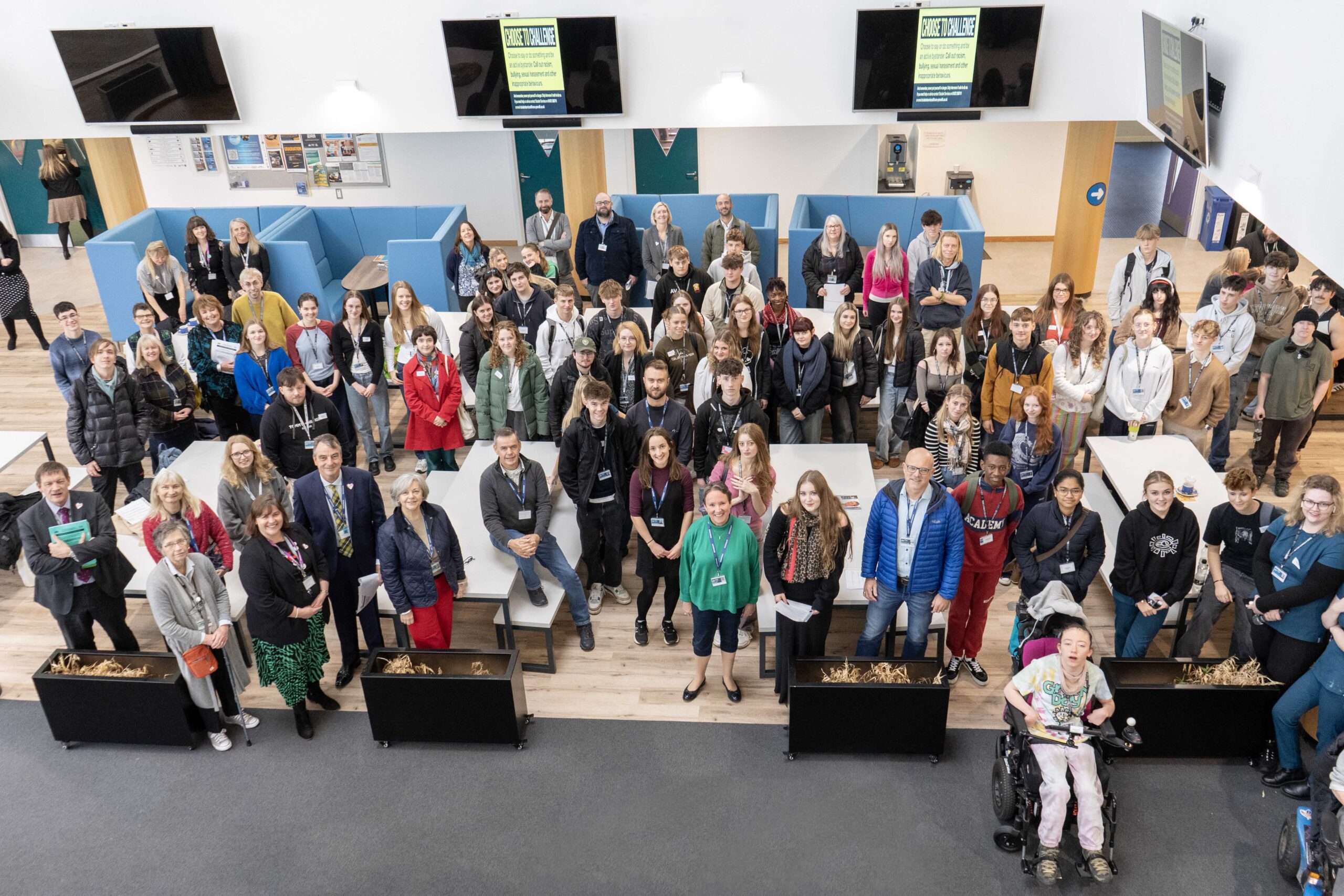 A photo from the Governors' conference which features governers and students from Truro and Penwith College. Everyone gathers in the Fal building and the photo is taken from a balcony.