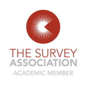 A logo which says The Survey Association Academic Member. The image is a red circle with a white sun shape inside.