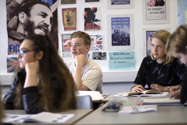 Students in a classroom looking towards the front.
