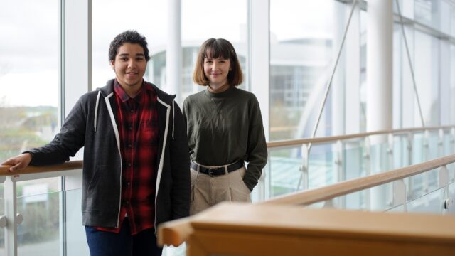 Two students stood on the balcony in the Fal building.