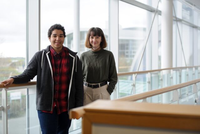 Two students stood on the balcony in the Fal building.