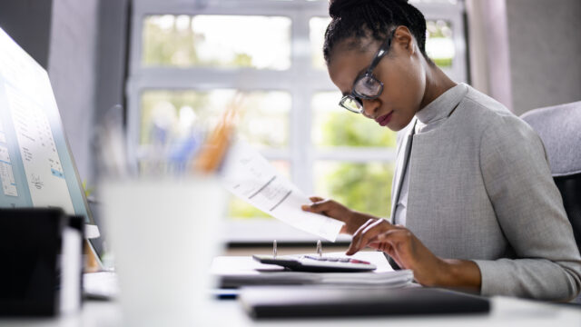 Accountant Or Auditor With Calculator.