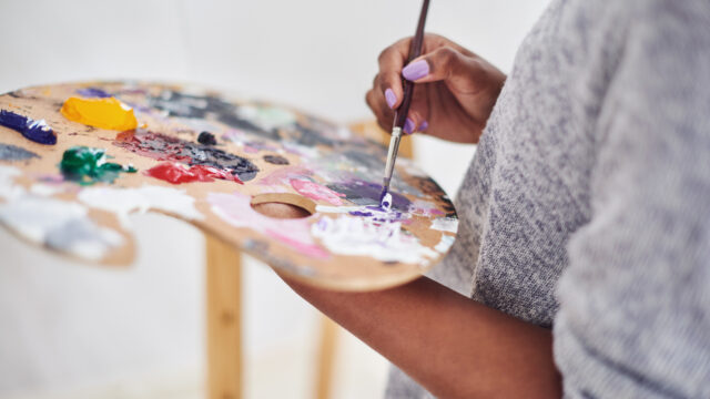 Cropped shot of an unrecognizable woman holding a painter's palette.