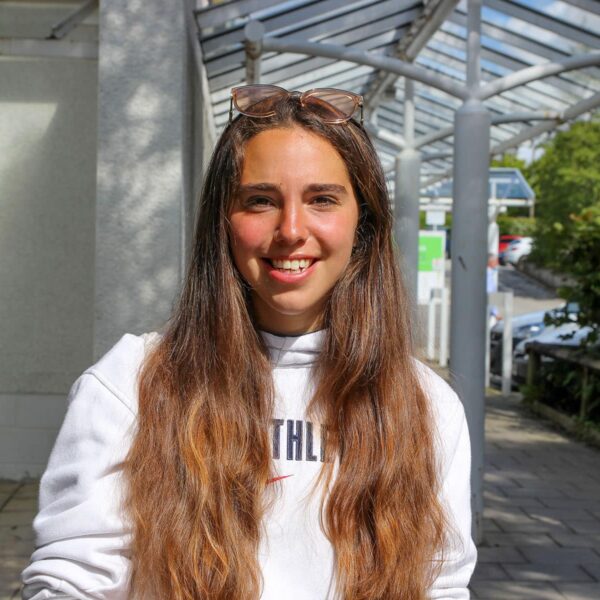 Amelie stood outside the college.