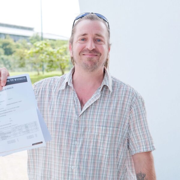 Andrew holding up his results.