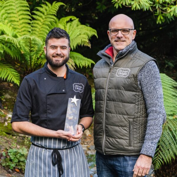 Ramon Van De Velde and Arron Robbins holding an award at the Lost Gardens of Heligan.