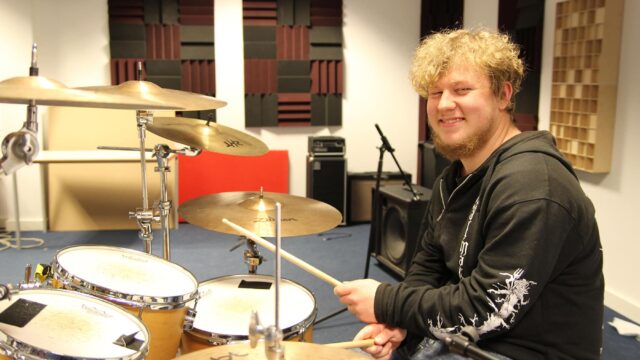 Student playing the drums.