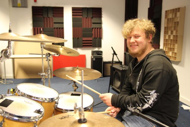 Student playing the drums.