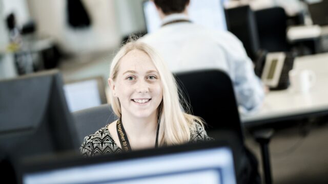 An apprentice sat at a computer.