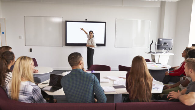 University students attending lecture on campus.