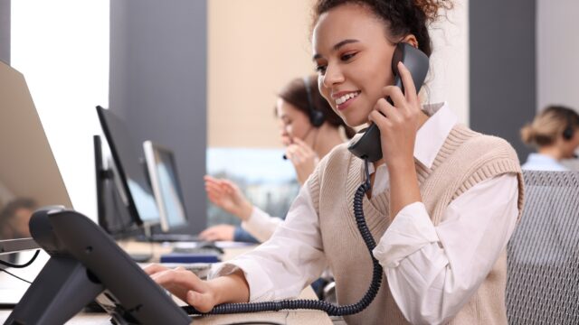 Call centre operators working in modern office.