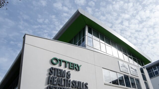 A picture of the outside of the Ottery building. There is a blue sky scattered with clouds.