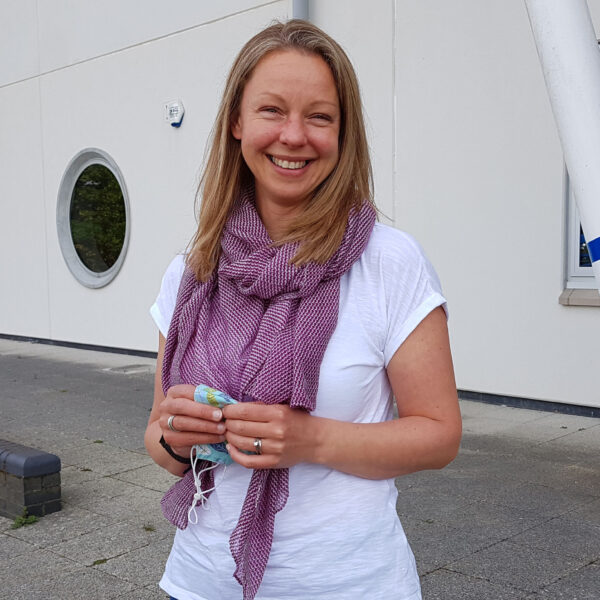 Chantelle Hickman stood outside a college building.