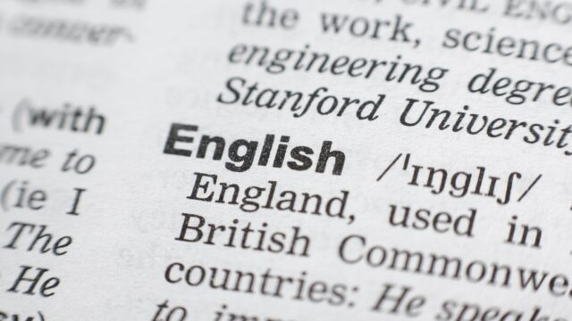 A close-up shot of the dictionary definition of the word English.