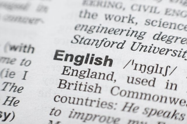A close-up shot of the dictionary definition of the word English.