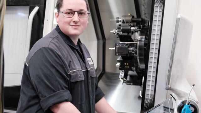A student engineer working with equipment.