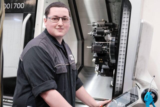 A student engineer working with equipment.
